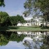 Clear waters reflect the unique design of the building.