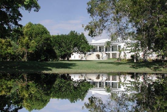 Clear waters reflect the unique design of the building.