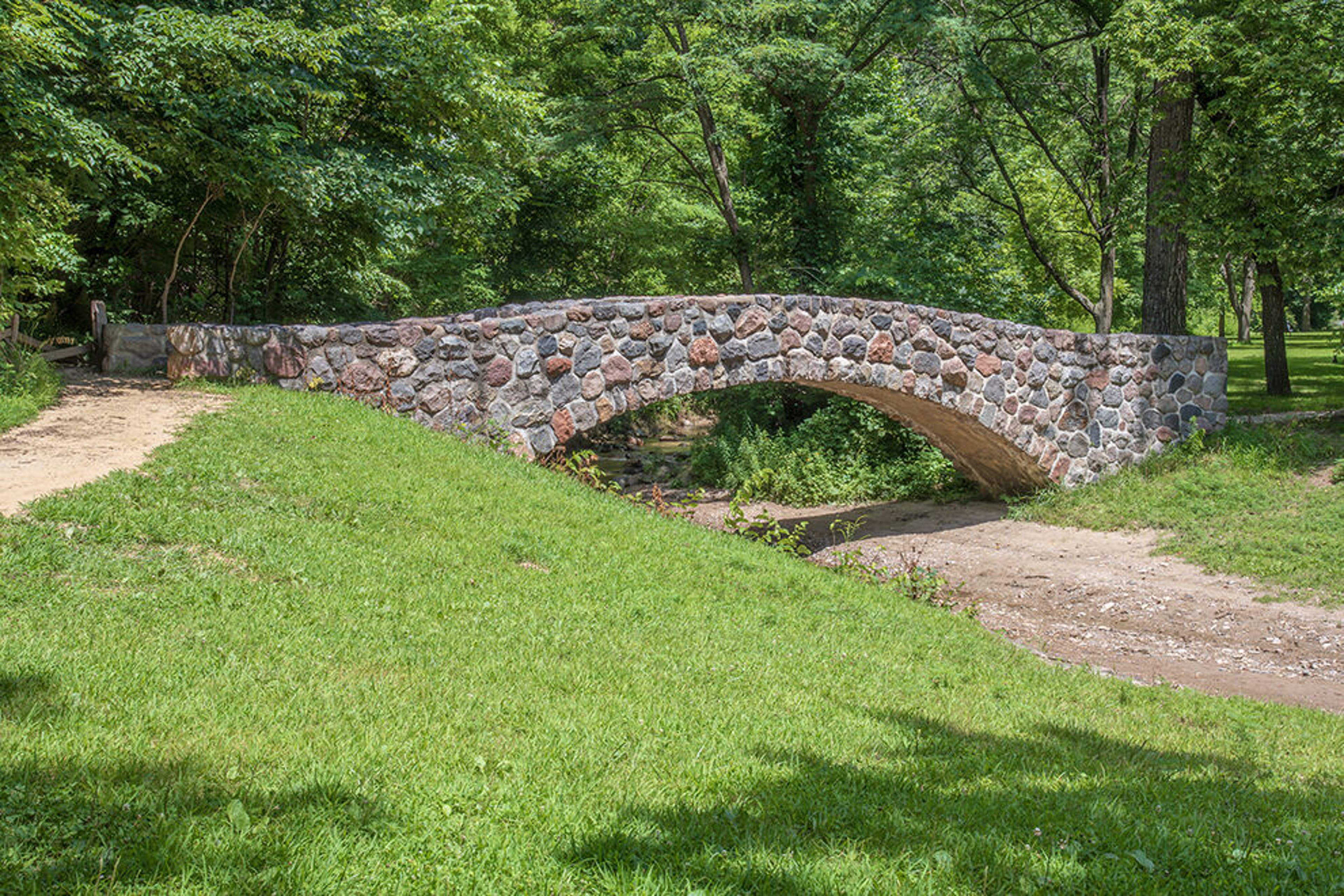 The Civilian Conservation Corps left its mark with stone arch bridges spanning Pea's Creek